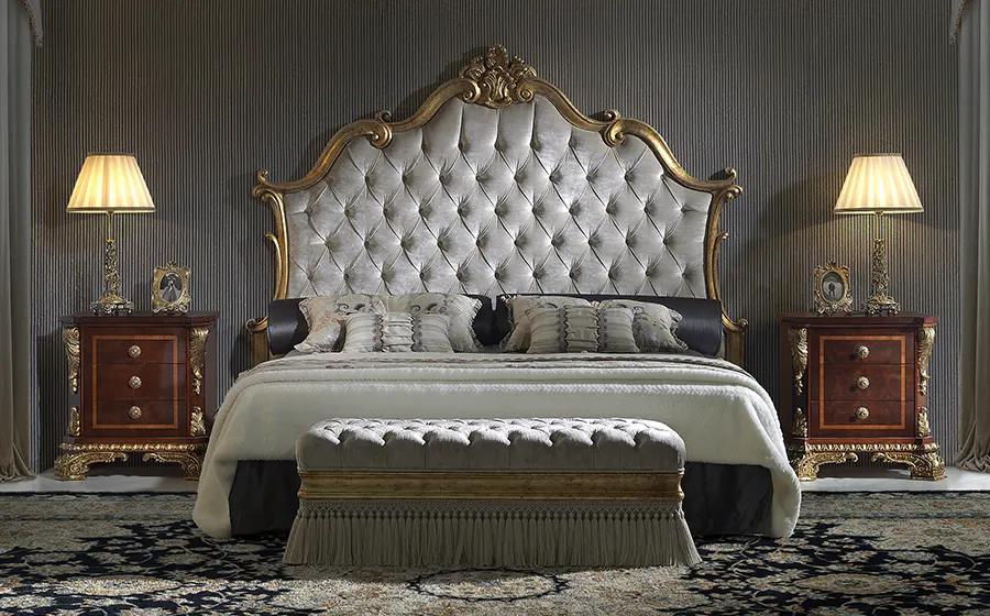 Classic luxury bed made in Spain featuring handcrafted upholstery, elegant headboard, premium materials and traditional furniture craftsmanship